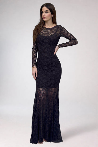 Woman wearing a black lace dress on a white background