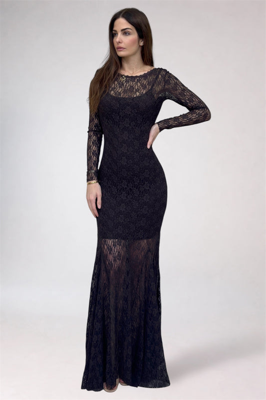 Woman wearing a black lace dress on a white background