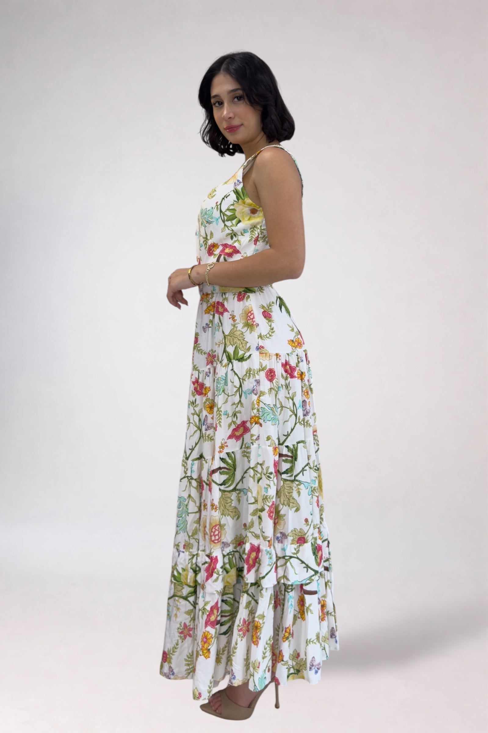 Woman wearing a floral dress on a white background