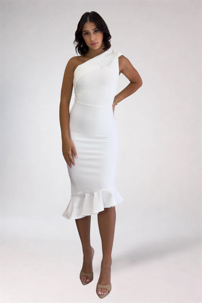 Woman wearing a white one-shoulder dress with ruffle details on a white background