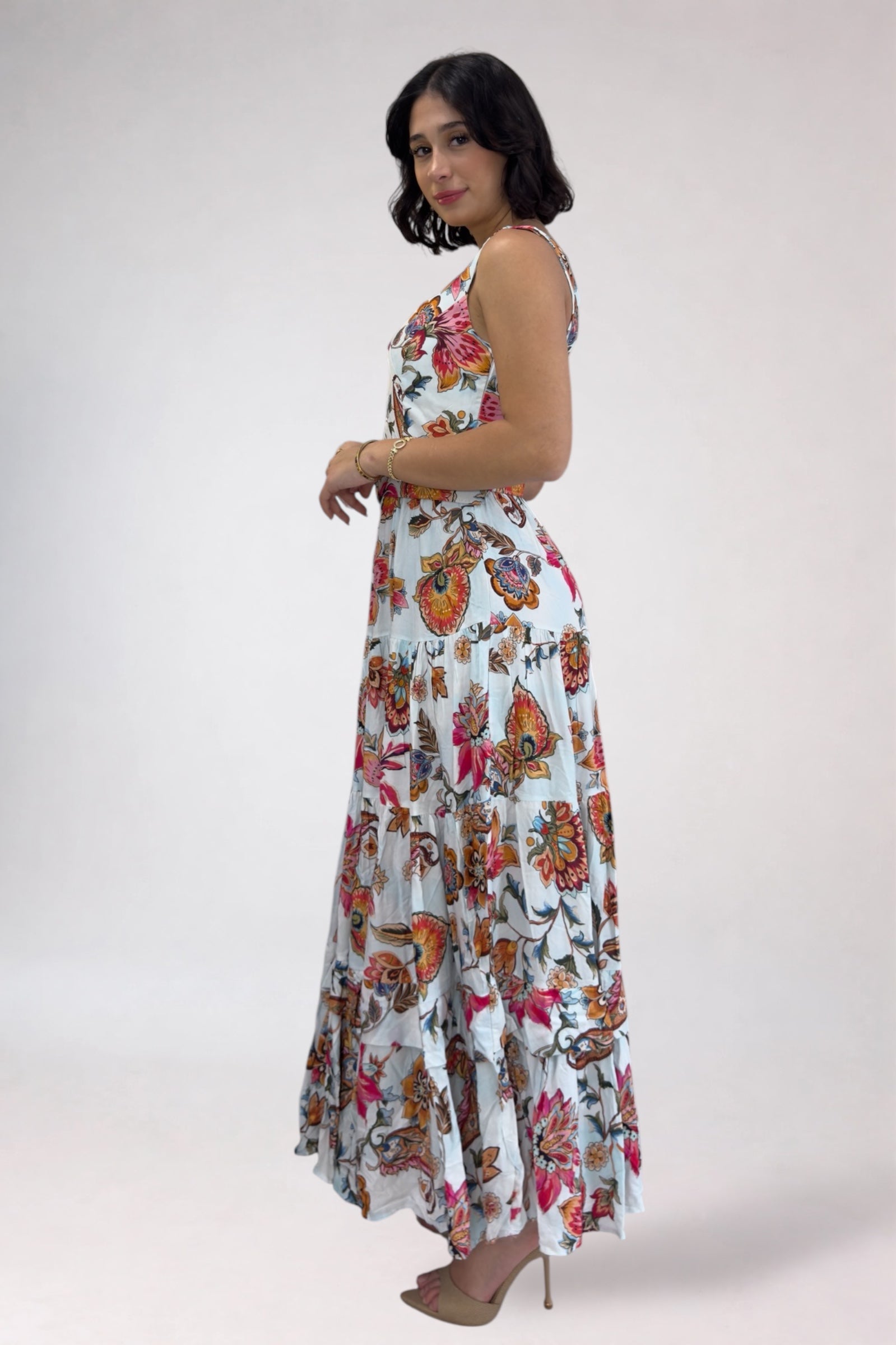 Woman wearing a floral dress on a white background