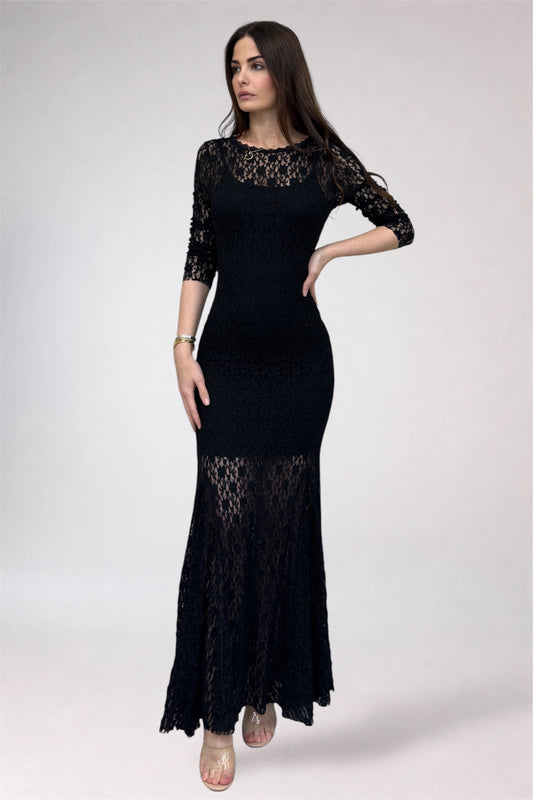 Woman wearing a black lace dress on a white background