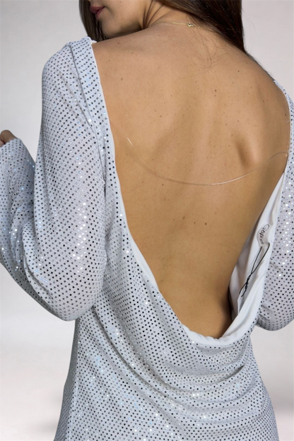 Light blue dress with open back on a plain background