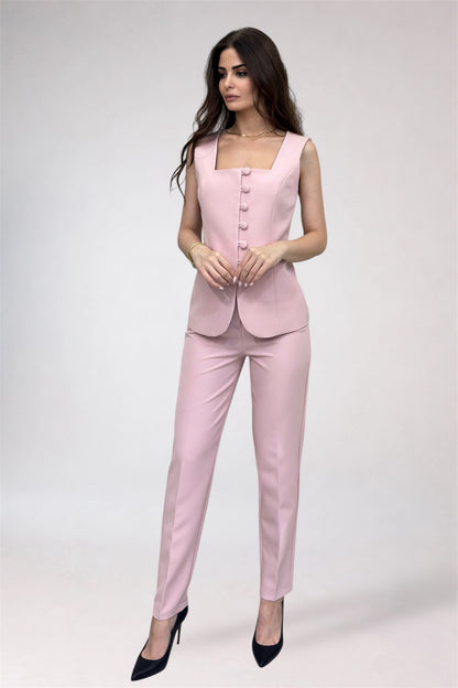 Woman wearing a pink suit on a white background