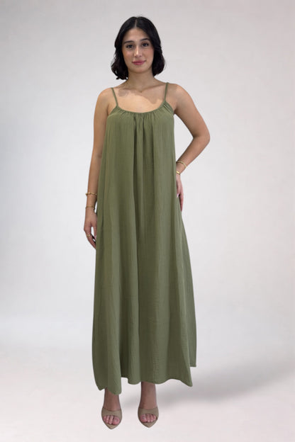 Woman wearing a green dress on a white background