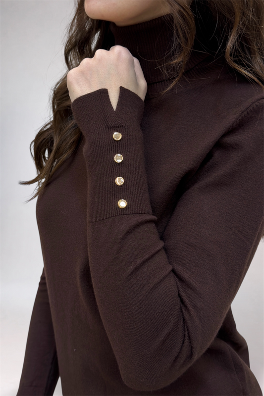 Brown sweater with button details on a plain background