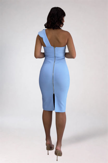Woman wearing a light blue dress with a zipper back on a white background