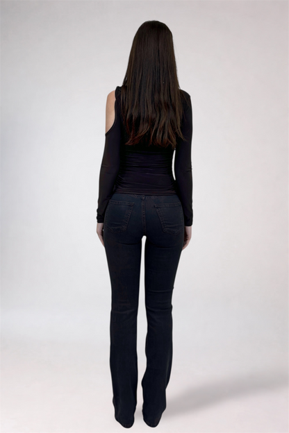 Person wearing black clothing on a white background