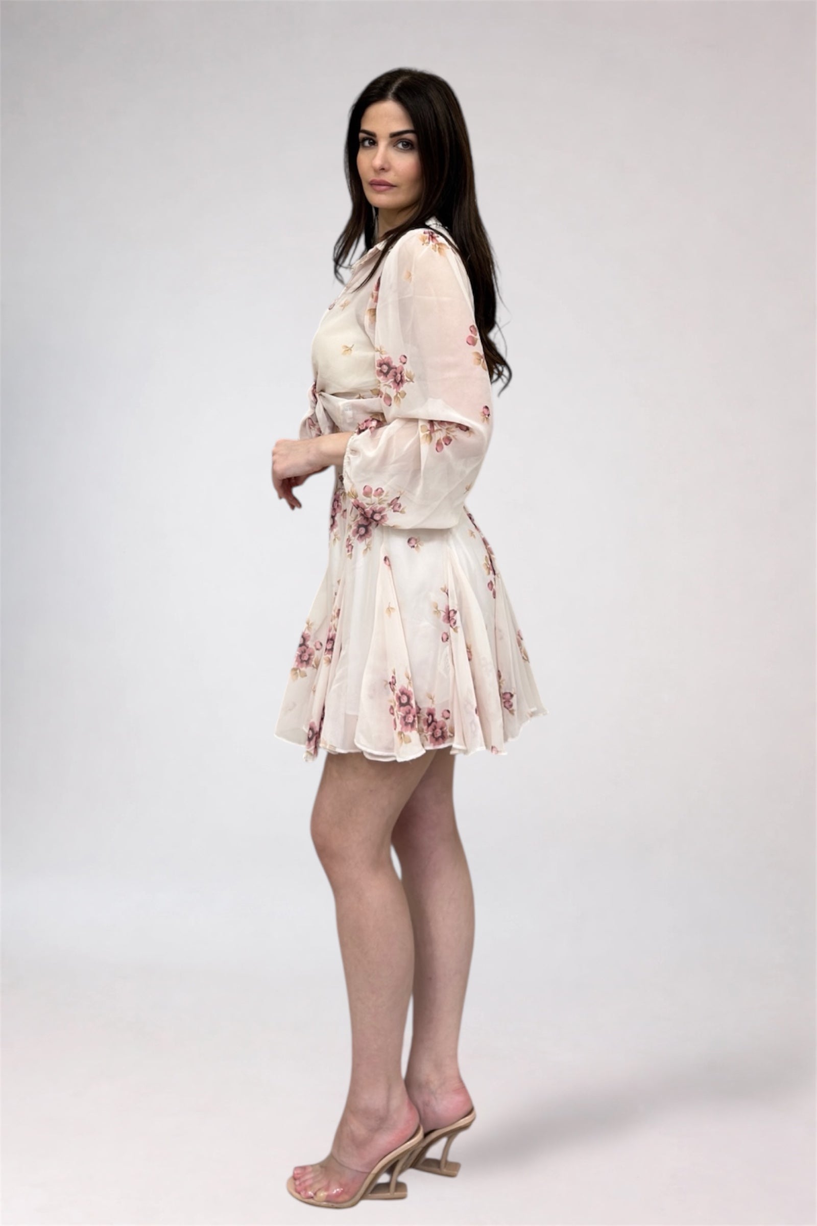 Woman wearing a floral dress on a white background
