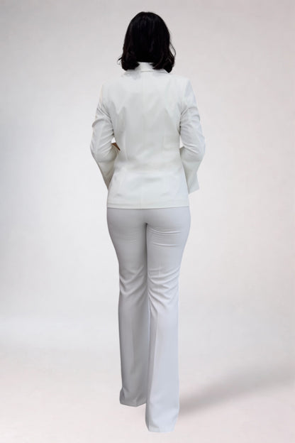 Person wearing a white outfit on a plain background