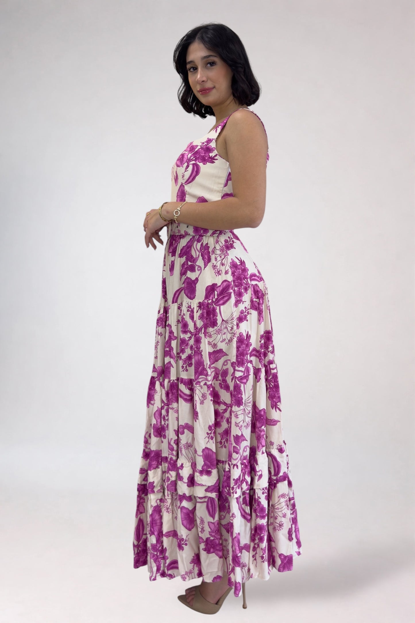 Woman wearing a floral dress with a white background