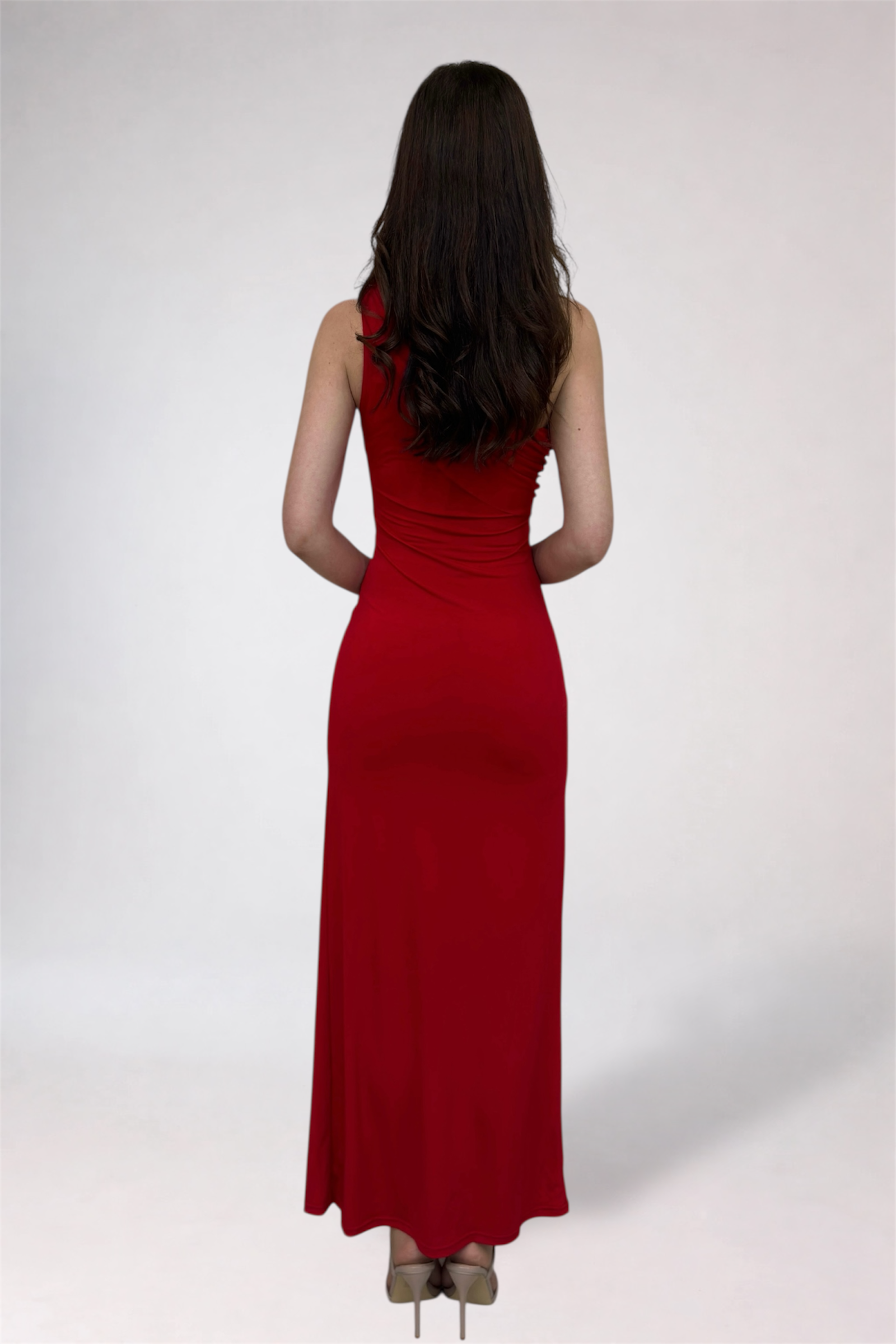 Woman wearing a red dress against a white background
