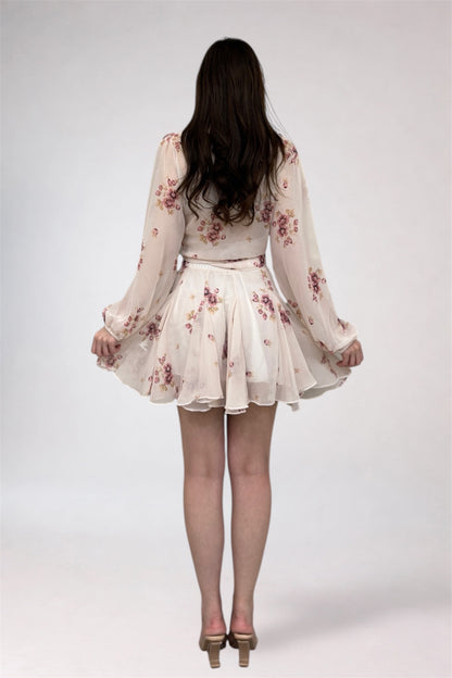 Woman wearing a floral dress on a white background