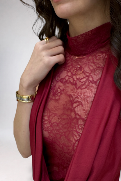 Red lace garment with a plain background