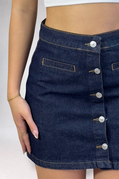 Denim skirt with button details on a plain background