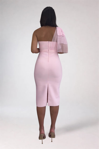 Pink one-shoulder dress with sheer sleeves on a white background