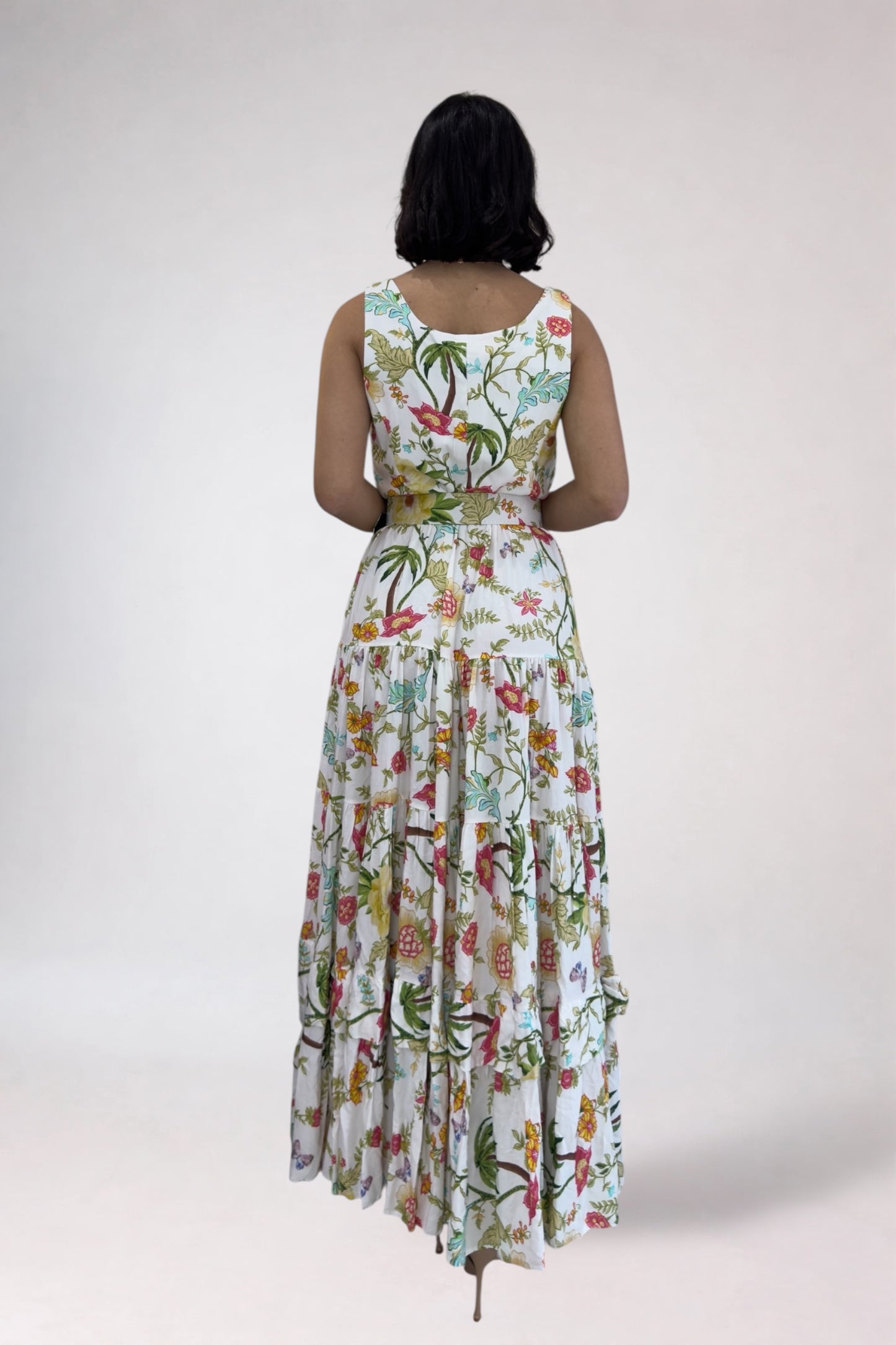 Woman wearing a floral dress with a white background