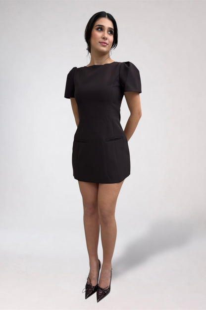 Woman wearing a black dress on a white background