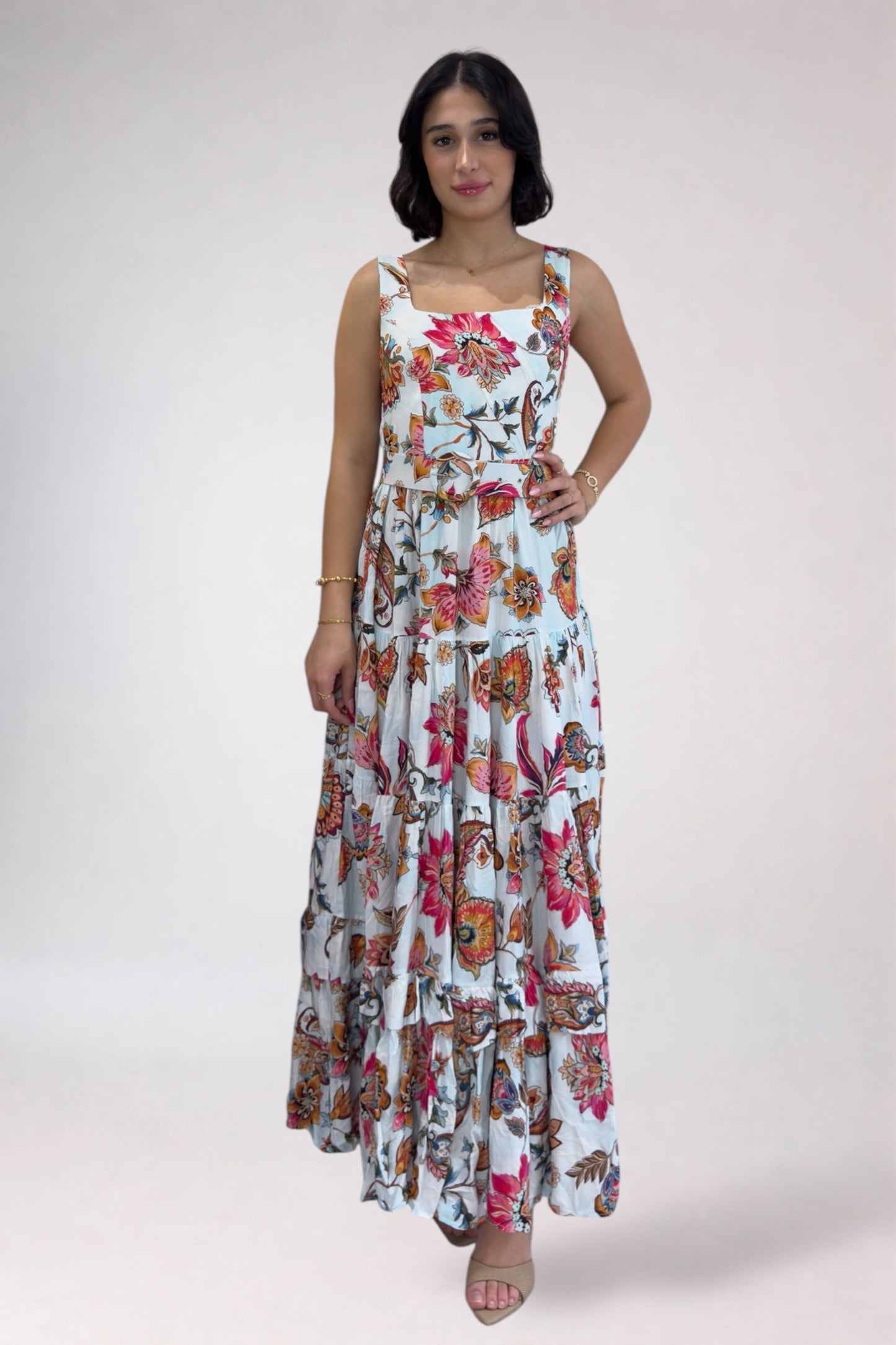 Woman wearing a floral dress on a white background