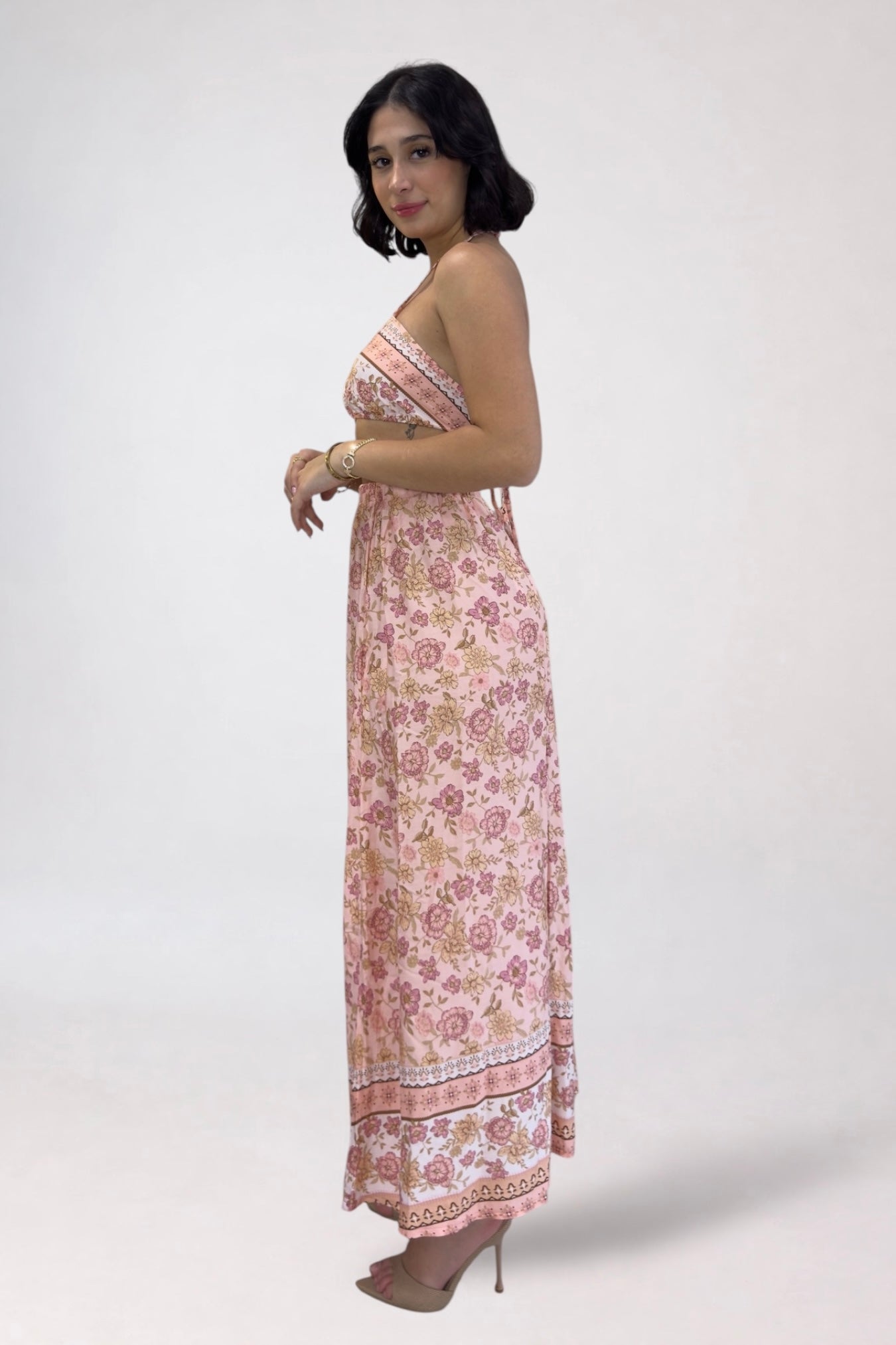 Woman wearing a floral dress on a white background