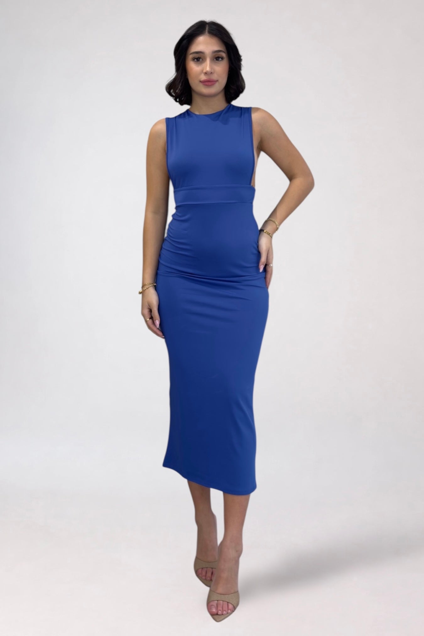 Woman wearing a blue dress on a white background