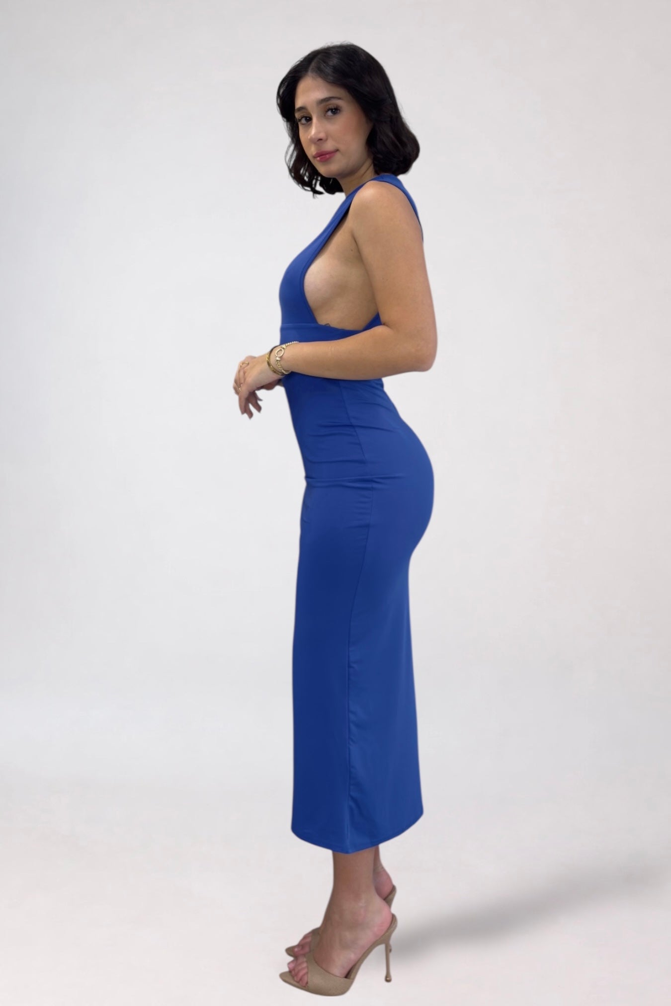 Woman wearing a blue dress on a white background