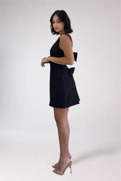 Woman wearing a black dress on a white background